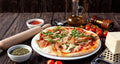 Pizza Gourmet con stoccafisso, olio al bergamotto e polvere d'arancia